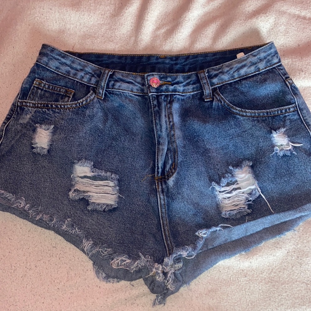 medium washed distressed jean shorts